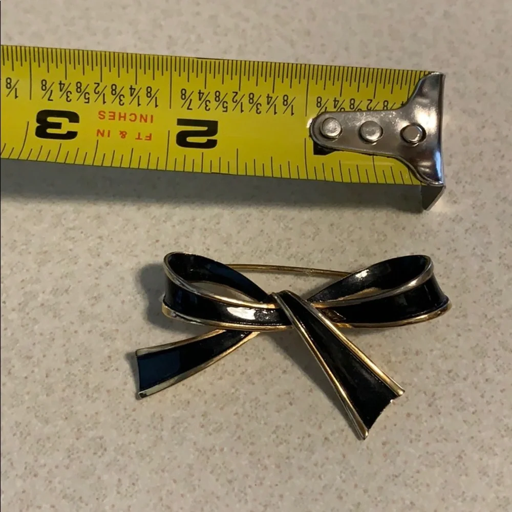 Trifari black gold bow pin